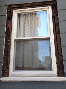 Here's how the window looked without any trim.  Note the boards as sheathing.
