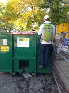 Mr. FW investigating a dumpster: definitely embracing the frugal weirdo