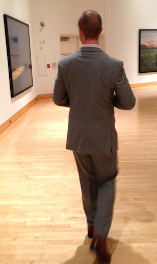 Mr. FW looking at some art at a wedding