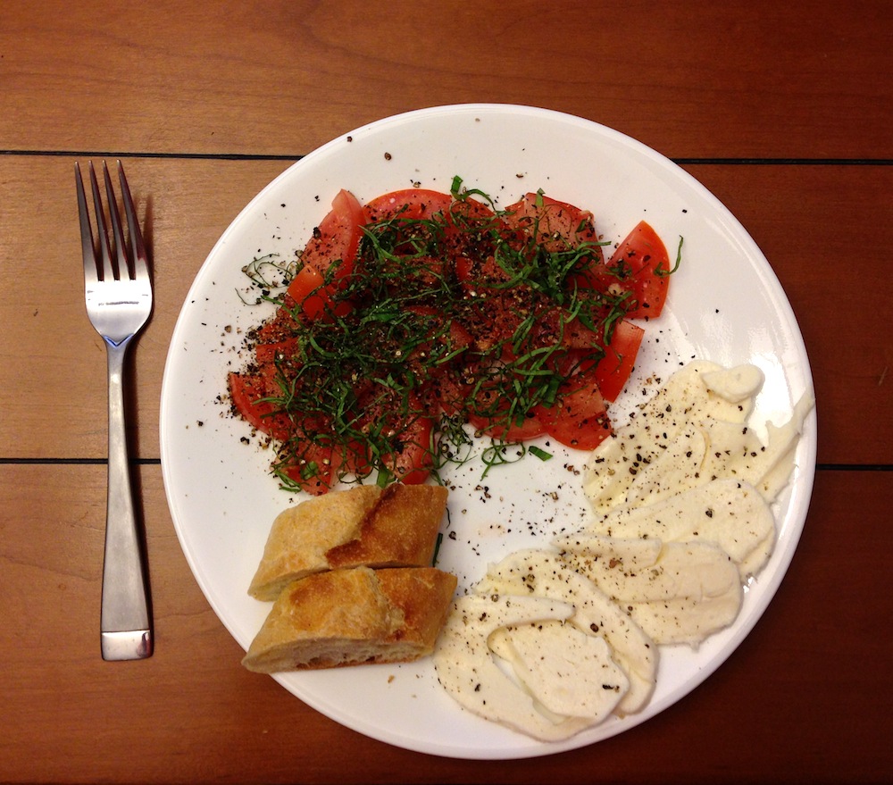 A tasty Caprese Salad with homemade bread
