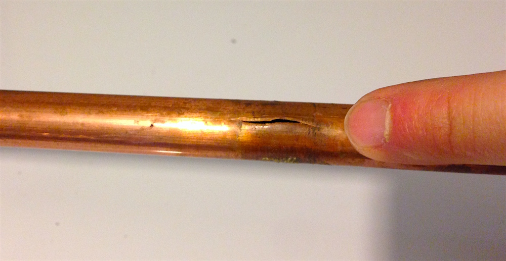 The burst copper kitchen pipe