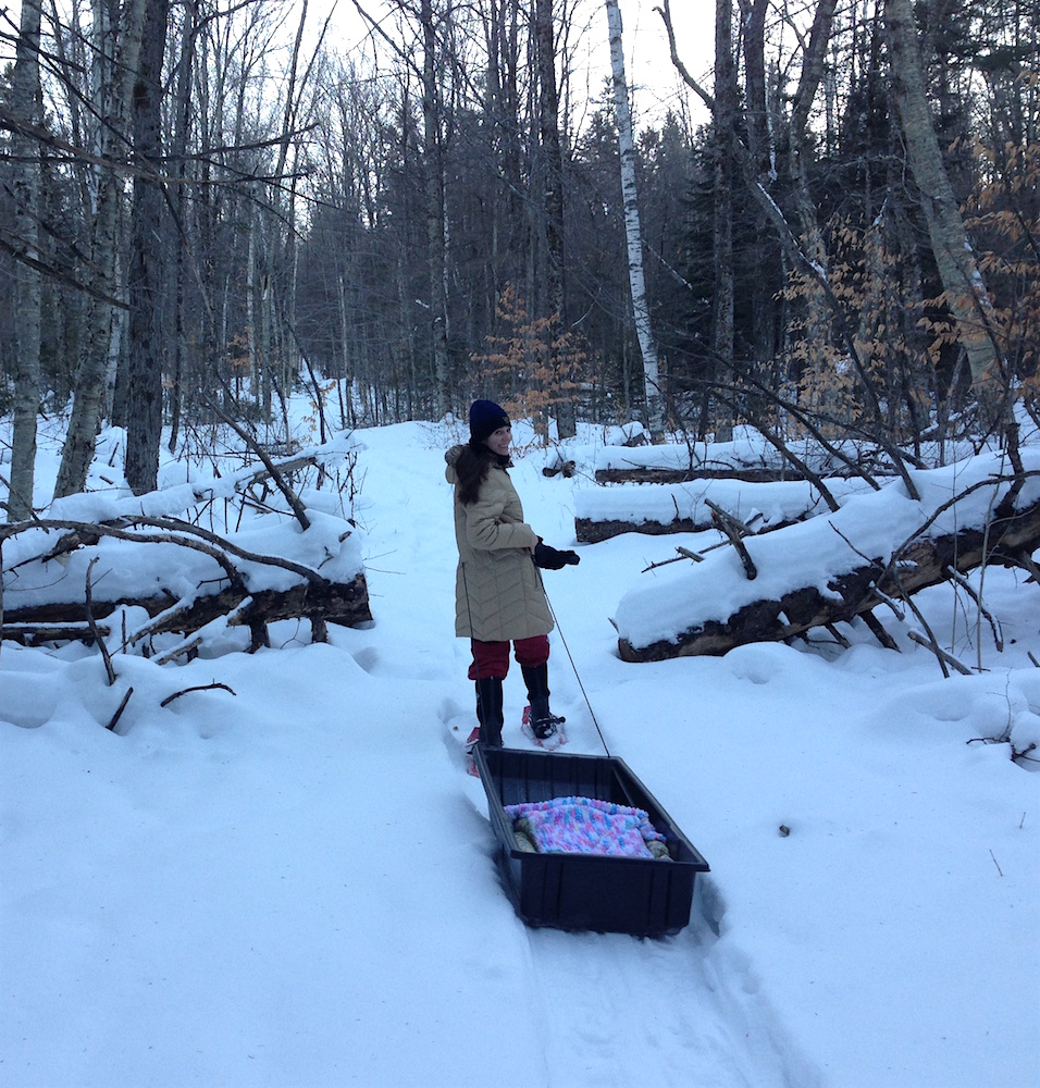 Me towing Babywoods in the game sled up our woodland trail.
