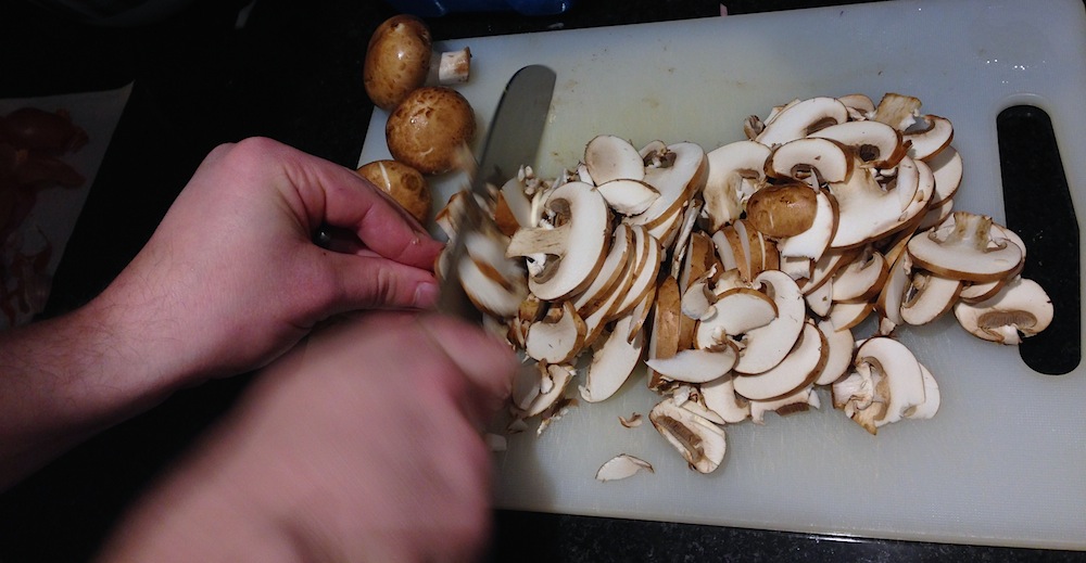 Washed mushrooms being chopped
