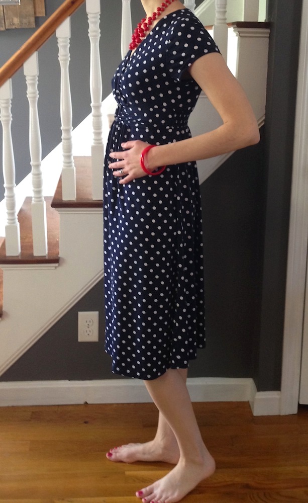 A photo we took yesterday of me at 16 weeks pregnant in a hand-me-down maternity dress.