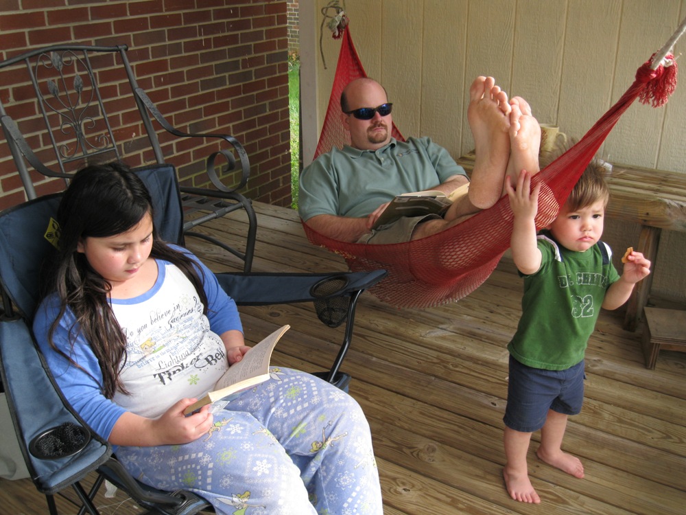 Relaxing on the back deck with good free library books